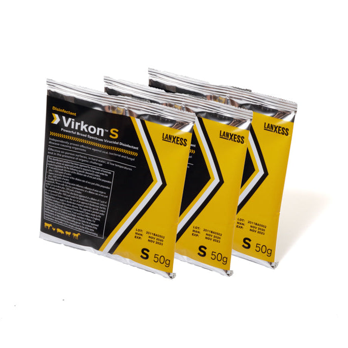 Three sachets of Virkon S on a white background